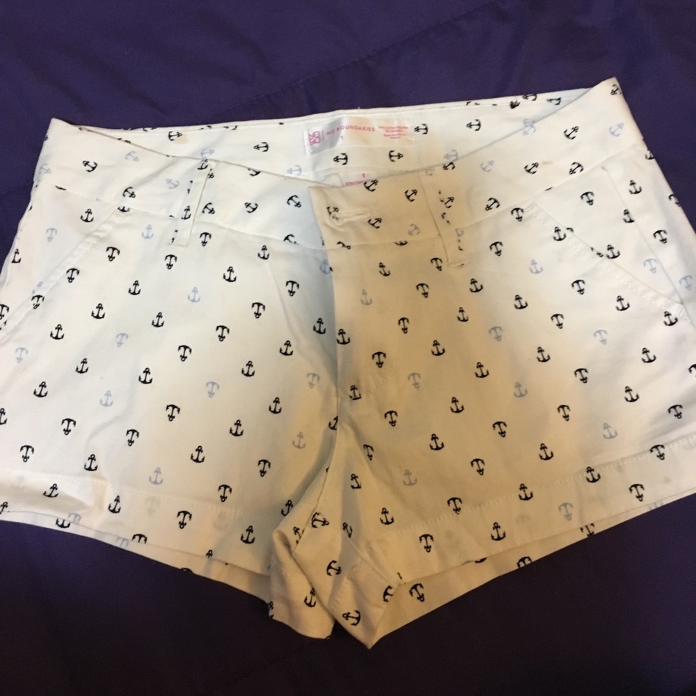 White shorts with different color blue anchors.